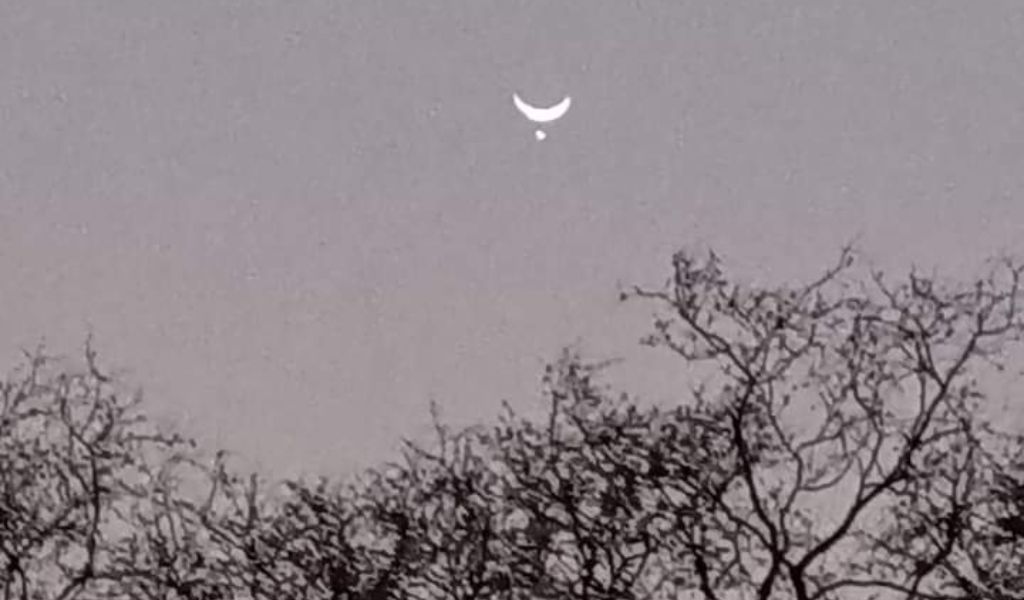 Venus disappears behind the Moon