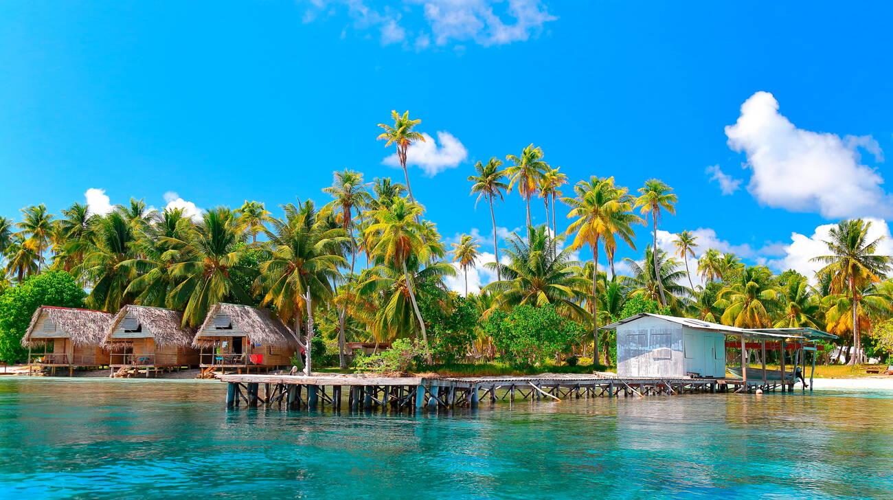 Coconuts, pontoons and farees of the village of Tetamanu in the south of the Fakarava atoll, Tuamotu archipelago, French Polynesia