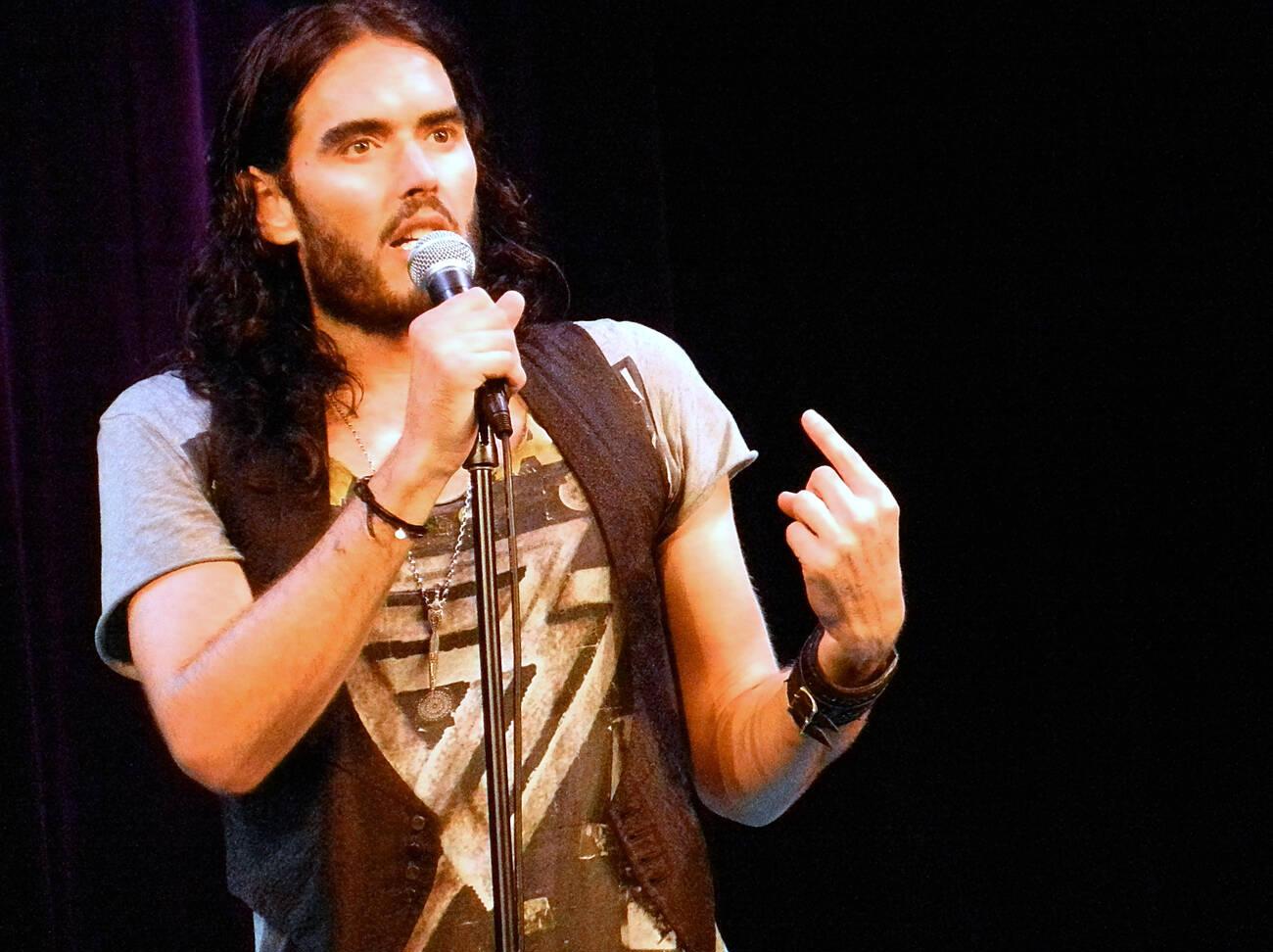 russell brand performing on stage