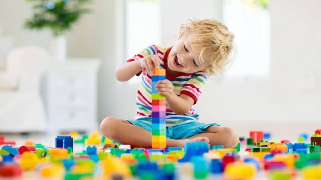 Child playing with toy blocks