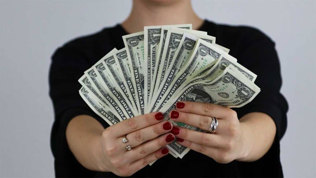 Displaying cash with hands