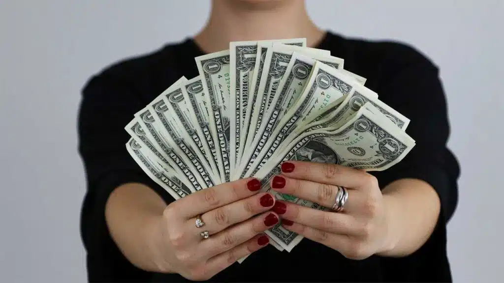 Displaying cash with hands