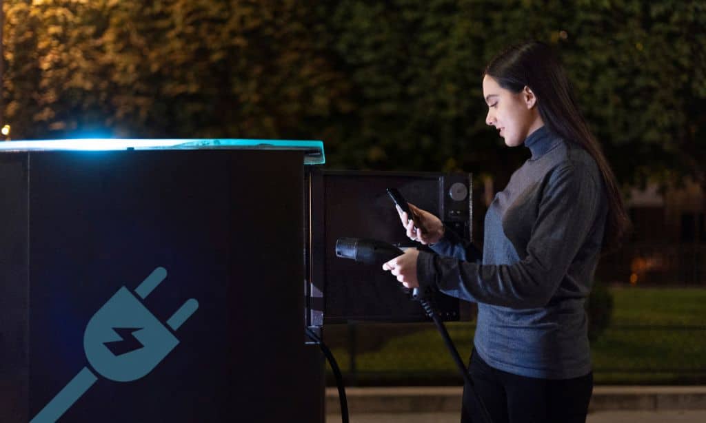 How do solar-powered device charging stations work outdoors