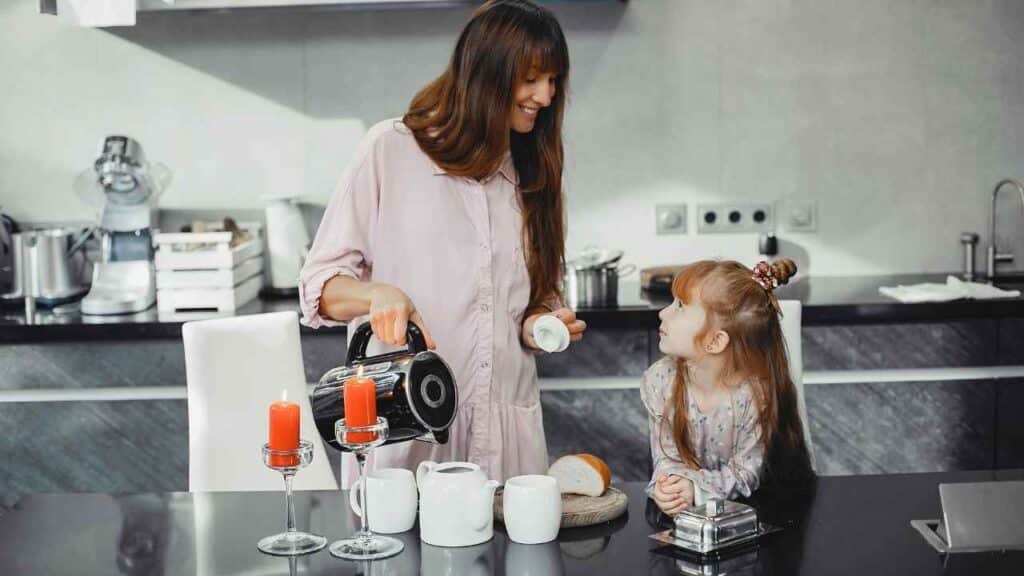 Mother with daughter in a kitchen